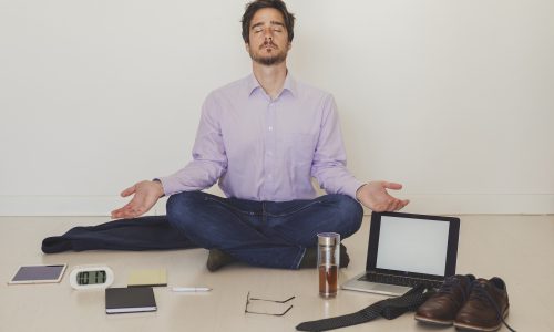 businessman-meditating-floor